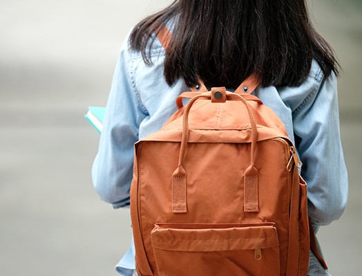 child with bookbag